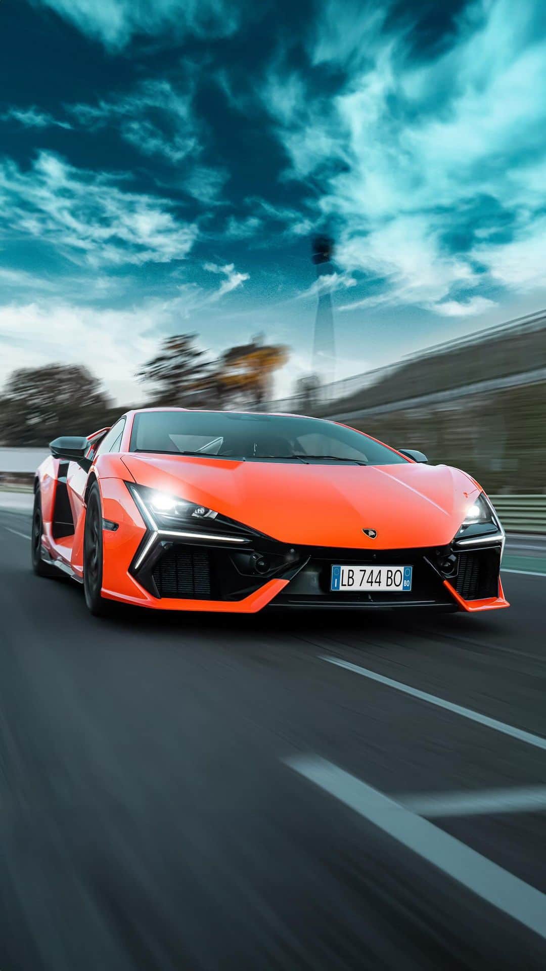 ランボルギーニのインスタグラム：「Uncommon power. Excellent drivability.    That is what Lamborghini Revuelto meant for racing driver Andrea Caldarelli. On the eve of the international dynamic debut at the Autodromo Piero Taruffi in Vallelunga, the Lamborghini factory driver tested our first V12 hybrid on this legendary Italian circuit. Needless to say, he was left speechless, as were we.    #Lamborghini #Revuelto #FromNowOn  __  The vehicle is not yet offered for sale and is therefore not subject to Directive 1999/94/EC. The fuel consumption and emissions data is in the type approval stage」