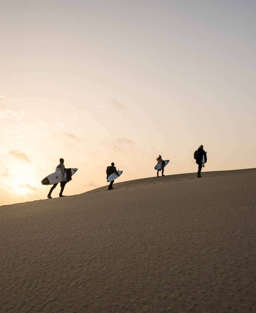 BILLABONG WOMENSさんのインスタグラム写真 - (BILLABONG WOMENSInstagram)「After a long day out on the water surfing the break in front of our cabins, we decided to head to the dunes. We packed a cooler and hit the road aiming to get there around sunset, about an hour drive away. It took a bit of off roading to get there, boards and camera gear flying as we ripped through the sand and rocky terrain with the windows down and music blasting. We pulled up to the dunes overlooking the ocean right at golden hour and watched the sun set over the Atlantic. Perfect end to the day. Watch the film, link in bio. #BillabongAdventureDivison」9月30日 1時00分 - billabongwomens