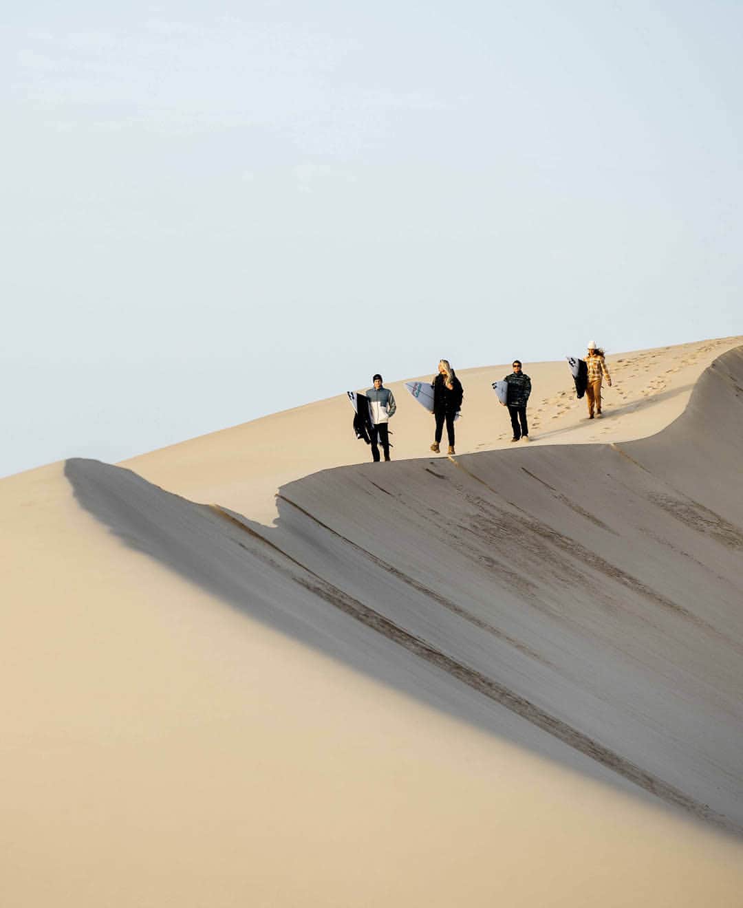 BILLABONG WOMENSのインスタグラム：「After a long day out on the water surfing the break in front of our cabins, we decided to head to the dunes. We packed a cooler and hit the road aiming to get there around sunset, about an hour drive away. It took a bit of off roading to get there, boards and camera gear flying as we ripped through the sand and rocky terrain with the windows down and music blasting. We pulled up to the dunes overlooking the ocean right at golden hour and watched the sun set over the Atlantic. Perfect end to the day. Watch the film, link in bio. #BillabongAdventureDivison」