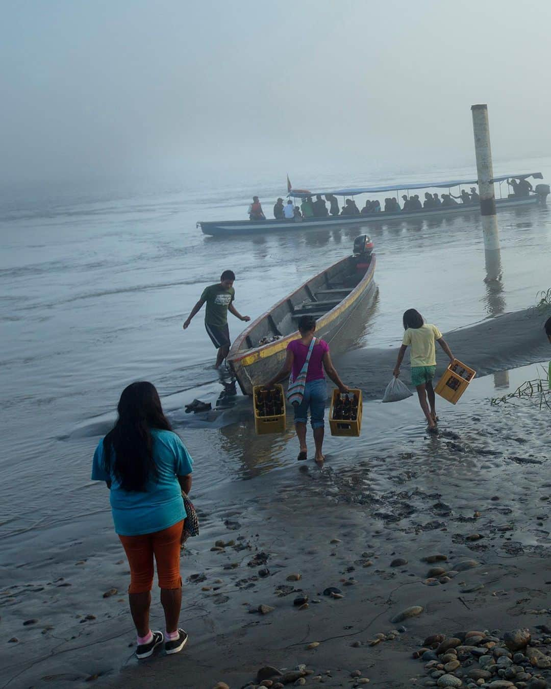 thephotosocietyさんのインスタグラム写真 - (thephotosocietyInstagram)「Photos by @ivankphoto // On August 20th, 2023, Ecuadorians voted against drilling for oil in the Yasuní National Park. The park, one of the most biodiverse places in the world, is home to the Waorani and the Kichwa, as well as two indigenous communities living in voluntary isolation, the Tagaeri and Taromenane. These photos were made in and on the border of the Yasuní National Park in 2012 for National Geographic Magazine with Karla Gachet (@kchete77).     -The Baihua and Tega families meet up in the river after the Tega family had hunted a monkey, a Peccary and a deer near the Waorani community of Bameno.   -Waorani drink beer in a bar at the Pompeya Market on the Napo River.   -A Supervisor points at a Repsol refinery on the Maxus Road near the Waorani community of Yarentaro.   A Kichwa family prepares to cross the Napo River from the beginning of the Maxus Road.   - Minihua Huani and I stand in the jungle near the Waorani community of Boamano.」9月30日 12時45分 - thephotosociety