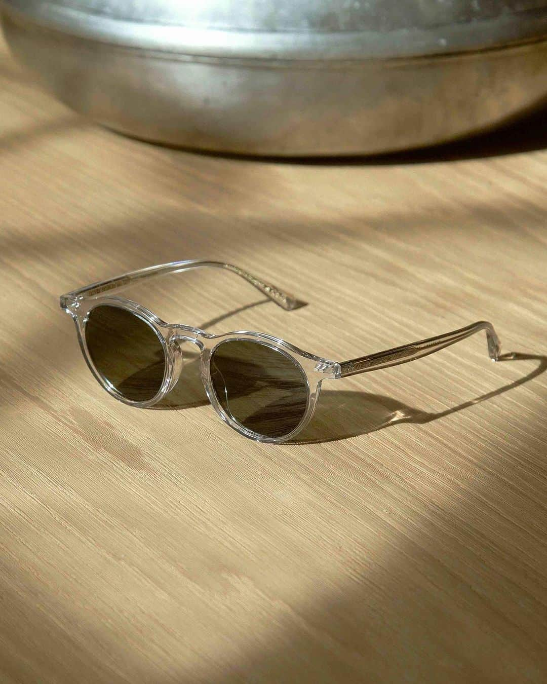 オリバーピープルズのインスタグラム：「Made in Japan, OP-13 Sun is distinguishable by its wide endpieces and round lens shape. A revival style from 1994, this classic frame glistens in Gravel acetate.」