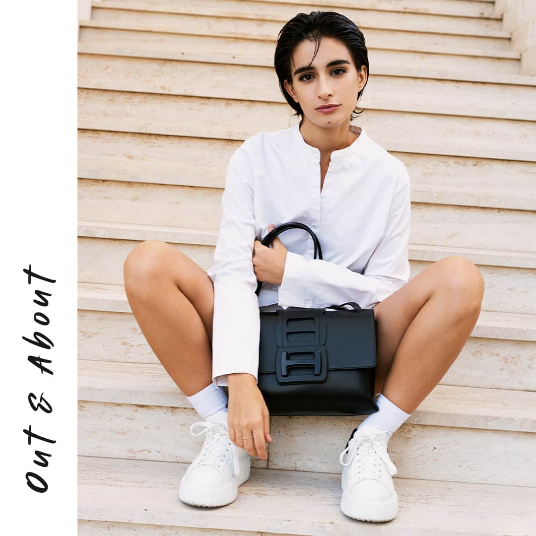 ホーガンのインスタグラム：「Your search for the perfect urban accessory ends here with @michela.derossi in the #HOGAN H-Stripes #sneakers and HOGAN H-Bag⁣ #GenH ⁣ Discover more via link in bio」