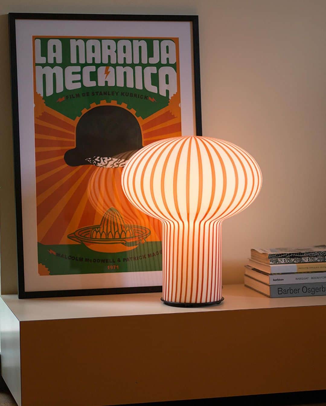 Design Milkのインスタグラム：「@establishedandsons unveiled the newest additions to their lighting collection at the 2023 @l_d_f_official, and they've got our mouths watering! 🍬  The Filigrana 6 table lamp designed by Sebastian Wrong is truly a work of art, boasting candy-colored stripes + a Venetian mouth-blown shade that diffuses a soft, dreamy glow. ✨ Meanwhile, @martinogamper's Mark Light adds tradition + a subtle pop of color with its hand-applied glass rings, highlighted on a simple opal glass shade.  Head to our link in bio to see more! 🔗」