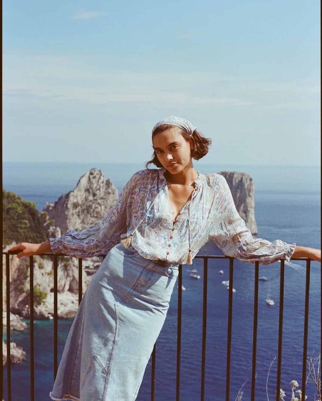 SPELLのインスタグラム：「Forever chasing the sun 🌞 @sahar_revell draped in the Belladonna Blouse + Eve Denim Skirt exploring the coastline of Capri…🐚」