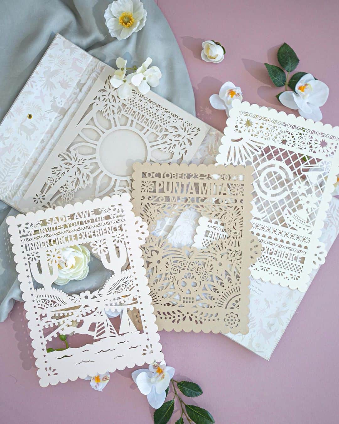 Ceci Johnsonのインスタグラム：「CORPORATE | Presenting the Couture Invitation design for @theinnercircleexperience Punta Mita 2023. Check out our last reel to see this playful invitation in motion! ⠀⠀⠀⠀⠀⠀⠀⠀⠀ Inspired by the host hotel @fspuntamita, we chose a calming, neutral color palette symbolizing the warmth and tranquility of the resort, alluding to the luxury the attendees will experience. The invitation features a handmade linen fabric folio, a prelude to the surprise inside. At the heart of this invitation lies a multi-dimensional, layered laser-cut paper art. Each panel represents the iconic landscapes and culture of Mexico while incorporating the event text into the Papel Picado artwork. The backdrop showcases the classic Otomi pattern in a soft nude hue, a tribute to the culture of Mexico. #CeciCouture #theinnercircleexperience  #SolidAsICE ⠀⠀⠀⠀⠀⠀⠀⠀⠀ #cecinewyork #coutureinvitations #mexicaninspiration #luxuryinvitations #otomipattern #luxuryevents」