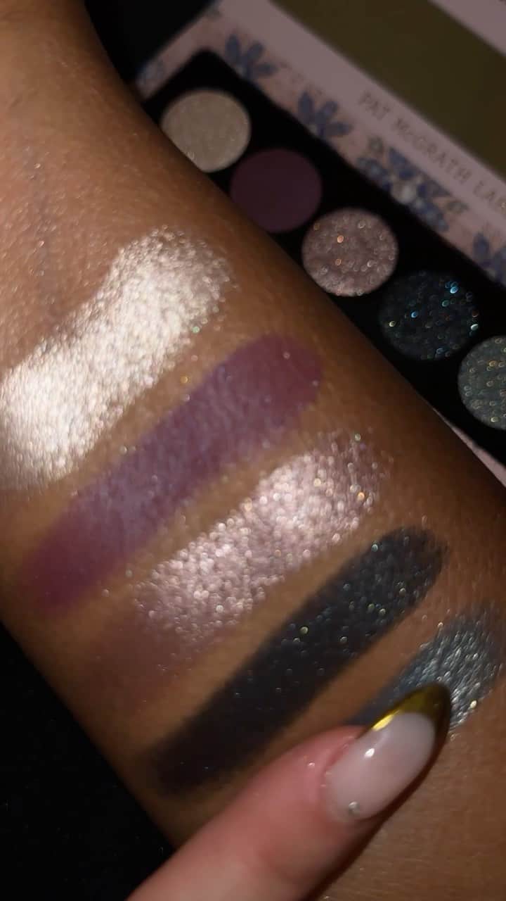 パット・マグラスのインスタグラム：「✨💎✨ LUNAR NIGHTSHADE ✨💎✨ Turn heads this #Holiday2023 with the NEW LIMITED EDITION Bijoux Brilliance Eye Shadow Palette: Lunar Nightshade. These DIVINE swatches unveil tones of violet mattes, champage shimmers, and golden aquatic hues. ✨💎✨ SHOP NOW at PATMcGRATH.COM.  ⚡️STARRING⚡️ Bijoux Brilliance Eye Shadow Palette: Lunar Nightshade ‘PLATINUM MOONLIGHT’ - Platinum Champagne Shimmer ‘MIDNIGHT IRIS’- Violet Plum Satin Matte  ‘PALE AMETHYST’ - Platinum Taupe Metallic  ‘NOIR NEBULA’ - Deep Indigo Metallic with Teal Sparkle  ‘NEPTUNIAN ORCHID’ - Aquamarine Metallic with Golden Sparkle」