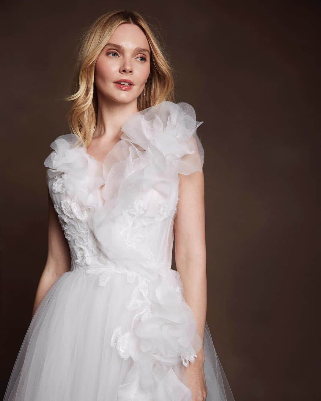 Marchesaのインスタグラム：「Immerse yourself in a realm where the timeless allure of nature converges with couture elegance. Inspired by nature's seasonal transformations, the collection has a deep sense of authenticity, honoring the unique craftsmanship that is Marchesa Couture.  Photography: @haifaphotography Model: @onlyenly Make up: @mayelavazquezbeauty Hair: @vanessa.ocando Backdrop: @oliphantstudio #Marchesa #MarchesaBridal #FW24MarchesaBridal #NYBFW」