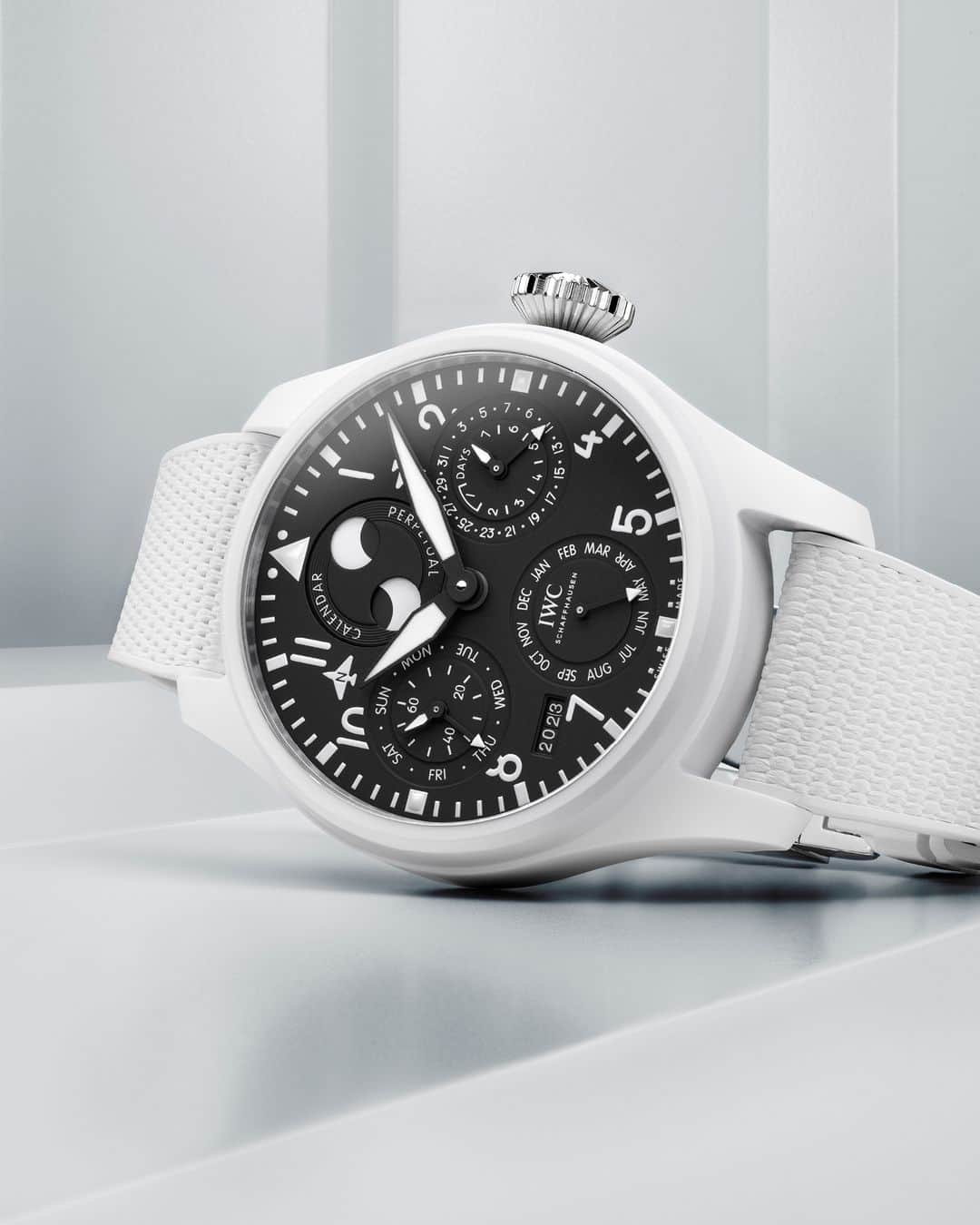 IWCのインスタグラム：「Stark contrast.   Pitch-black dial and black hands contrasting a brilliant white ceramic case for a striking combination: The Pilot's Watch Perpetual Calendar Top Gun Lake Tahoe. IWC experimented with this color as early as the 1980s, shortly after introducing its first wristwatch with a black zirconium oxide ceramic case. White ceramics are emblematic of IWC’s materials expertise.  #IWCpilot | #IWCtopgun | #IWClaketahoe  🔗Link in Bio 📸 Ref. IW503008」