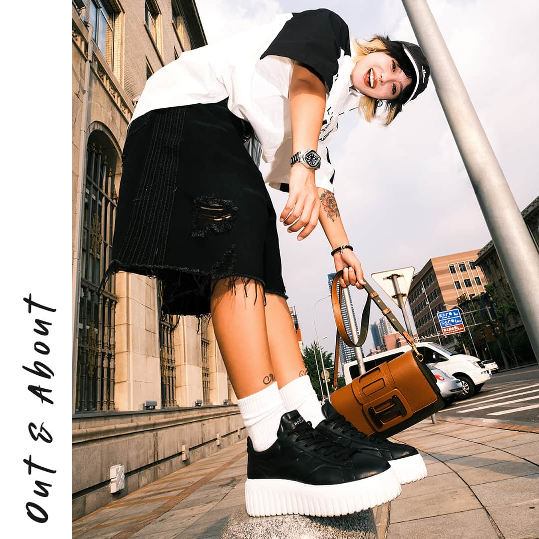 ホーガンのインスタグラム：「Upgrade your accessory game with the structured allure @alessoyoko in the #HOGAN H-Stripes #sneakers and HOGAN H-Bag⁣ #GenH #刷街超豪凹⁣ Discover more via link in bio」