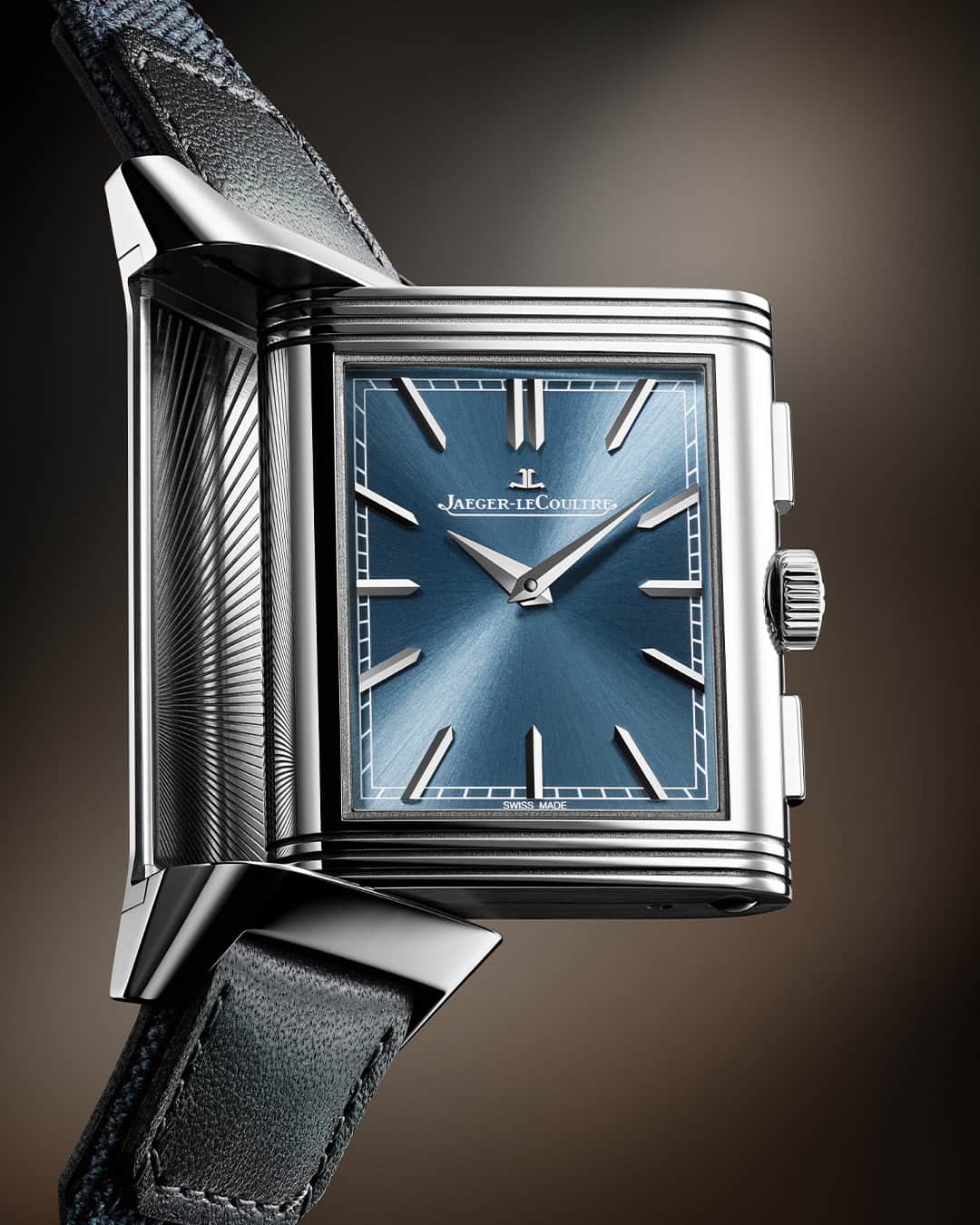 ジャガールクルトのインスタグラム：「An understated complexity.  #Reverso _ Reverso Tribute Chronograph Designed, made and assembled in our Manufacture  _ The front dial of the Reverso Tribute Chronograph bears all the hallmarks of the Reverso Tribute line with its baton hour markers, Dauphine hands and chemin de fer minutes track. The blue-grey dial is complemented by a steel case which apparent simplicity is compromised by the two pushers on the side of the crown. _ #JaegerLeCoultre #Reverso #TheWatchmakerOfWatchmakers」