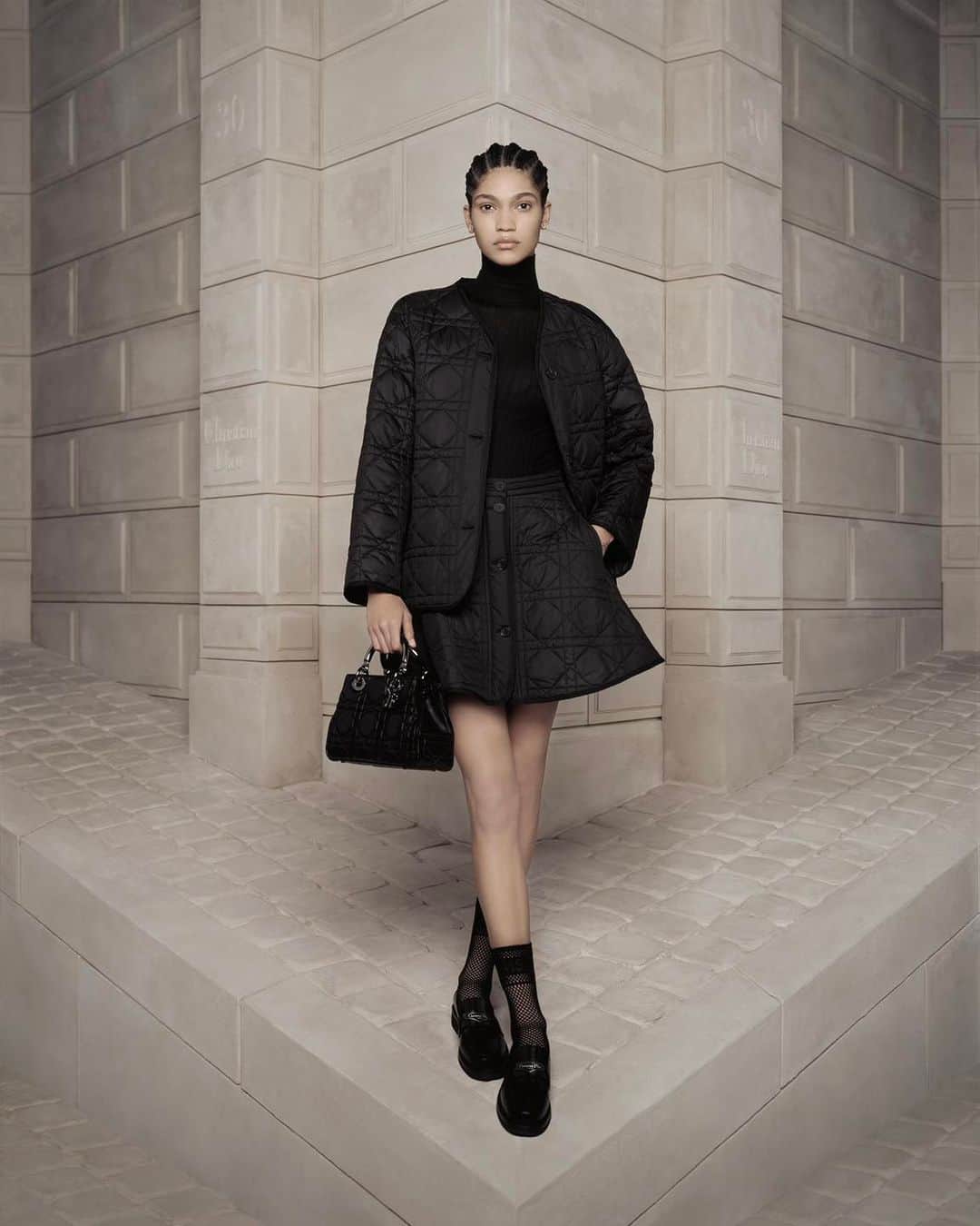 クリスチャンディオールさんのインスタグラム写真 - (クリスチャンディオールInstagram)「Encapsulating the essence of the #Dior30Montaigne collection by @MariaGraziaChiuri, this sleek black jacket is reborn in a contemporary Macrocannage twist, paired flawlessly with a matching skirt and accompanied by the exquisite #DiorLady9522 bag. © @BrigitteNiedermairStudio」10月5日 21時00分 - dior