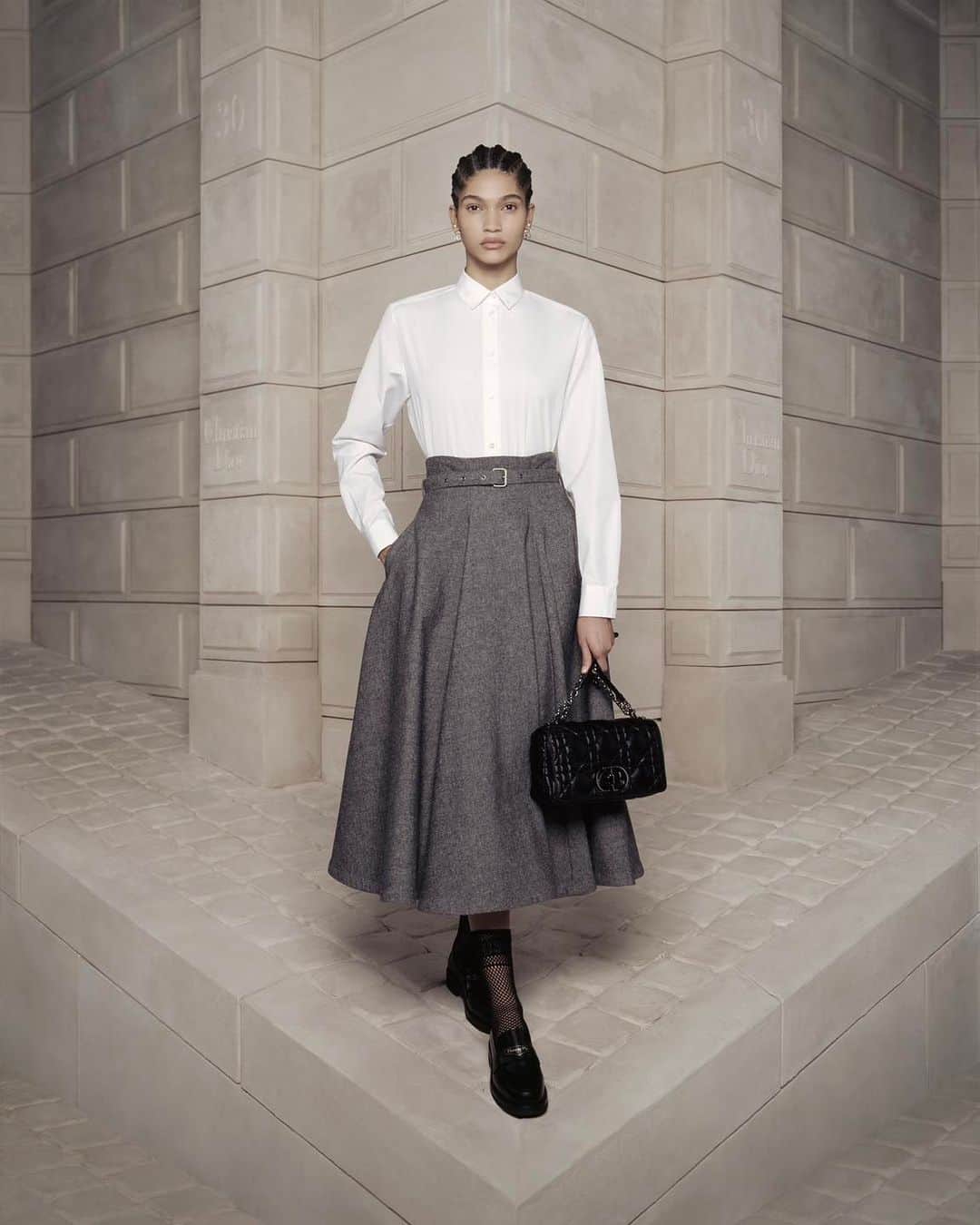 クリスチャンディオールさんのインスタグラム写真 - (クリスチャンディオールInstagram)「Explore the craftsmanship revealed in the latest designs by @MariaGraziaChiuri, skillfully incorporating an array of noble fabrics, from soft wool and silk to comfortable cotton, delicate lace, and the timeless durability of denim. These diverse materials come together in a symphony of rich colors, culminating in the #Dior30Montaigne collection. As a nod to Monsieur Dior's beloved gray, this hue is perfectly complemented by the #DiorCaro bag, expertly crafted from supple black leather contoured with distinct quilted-effect Macrocannage stitching. © @BrigitteNiedermairStudio」10月6日 1時21分 - dior