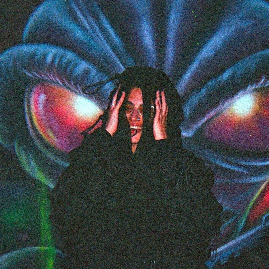 Dazed Magazineさんのインスタグラム写真 - (Dazed MagazineInstagram)「@COUCOUCHLOE arrives at @NQ64arcadebars in Shoreditch and almost immediately spills a drink over herself 👾⁠ ⁠ Although her ultra-gorpcore @anaselivanova jacket is collateral damage, she styles it out – her skin and hair glisten with a glass’s worth of booze and she adds a slick of lipgloss to finish the wet look. The bar we’re in is dark and neon-lit with flashing retro consoles and a very loud Chief Keef soundtrack.⁠ ⁠ The @nuxxe_ collective member has just released mixtape Fever Dream, a collection that is “two years of friends and life and everything”, she says. It draws together an impressive crop of collaborators including @eartheater 645ar @louisbrodinski @iamrealnene and mop-haired teen rapper @mattox⁠ ⁠ The cover art is a sketched caricature of COUCOU CHLOE, with an exaggeratedly large forehead, droopy-lidded eyes and a plumped-up, dissociative pout. “I liked the idea of a caricature, or a grotesque, as a way to let go... It was really interesting to see the perspective of someone who doesn’t know me at all. It's like, ‘What do you see?’”⁠ ⁠ Read the full interview through the link in our bio 🔗⁠ ⁠ ✍️ @felicitaaaay⁠ 📷 @hattirex⁠」10月7日 1時02分 - dazed