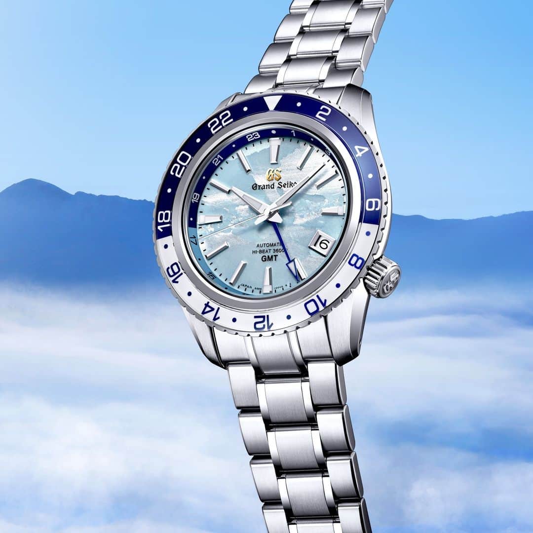 Grand Seikoのインスタグラム：「【Sport Collection Caliber 9S 25th Anniversary Limited Edition #SBGJ275 】 　 The new GMT watch lifts the imagination of skyward with a beautiful blue dial that illustrates a sea of clouds at daybreak. The shade of blue is inspired by the sky over Mt. Iwate when it is blanketed by this sea of clouds.  　 The dial’s organic pattern depicts the layered sea of clouds that envelops Mount Iwate as dawn breaks. The pale blue color overlaid on the pattern gives the dial the appearance of a sea of clouds floating in a beautiful sky.  #grandseiko #thenatureoftime #aliveintime」