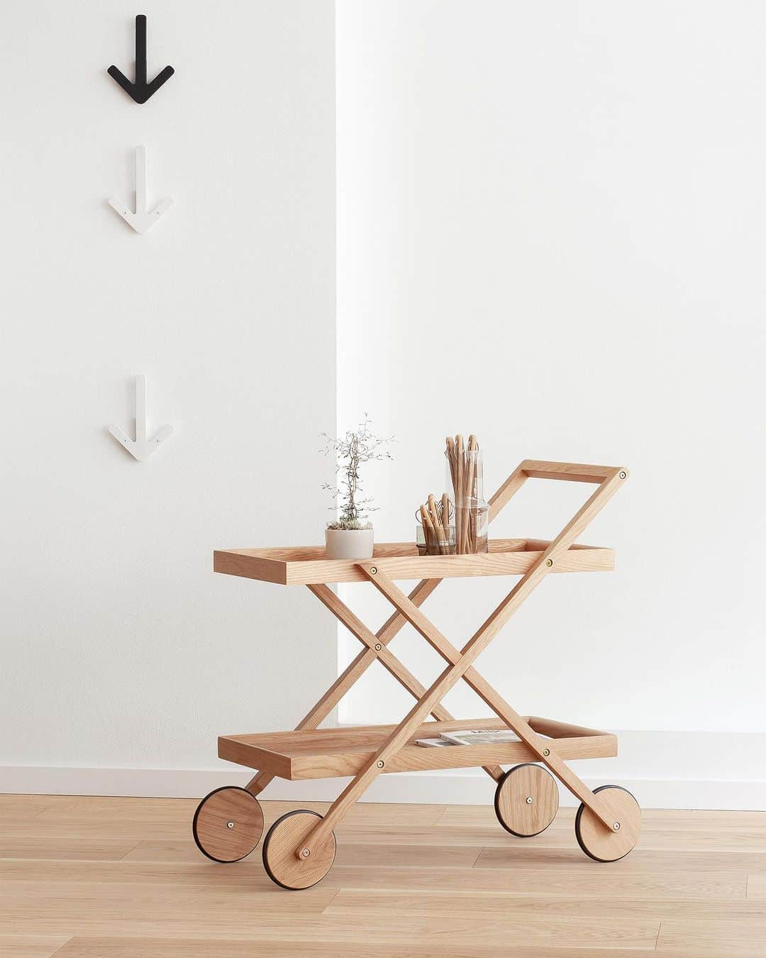 デザインハウス ストックホルムのインスタグラム：「I wanted to create a flexible and slender little trolley that supports and enhances the entire range of accessories presented by Design House Stockholm. I’ve chosen oak for both strength and character; it allows me to shape a distinctly graphic profile.” Gunilla Allard is one of Sweden’s most renowned furniture designers, and while she usually works in metal, she has managed to infuse Exit Trolley with that same kind of graphic precision in finely crafted oak. “It’s a challenge for me to work in wood. You would think you would have to allow for slightly thicker dimensions, but Exit Trolley is made as thinly as possible. The natural-looking wood conveys a softer touch for a cozier feel that is equally suited to private and public settings.”  #interior #interiordesign #architecture #interiorinspo #interiorinspiration #decor #theworldofinteriors #home #homedecor #interiordesigner #design #homedesign #decoration #decorlovers #interiordecorating #scandinaviandesign #swedishdesign #creative #artsy #artshow #newnordic #nordicdesign #trendy #newnordicdesign」