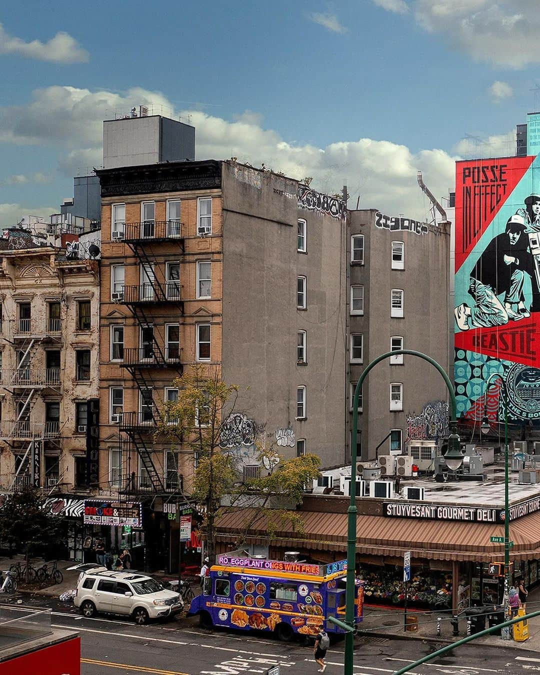 Shepard Faireyさんのインスタグラム写真 - (Shepard FaireyInstagram)「The crew and I just completed an 8 story @beastieboys mural as part of the NYC Hip Hop 50 celebration at the corner of 14th and Ave. A. After my best childhood friend started at NYU in 1990, I began putting up street art in the Village on a regular basis so this location is significant for me. This is also an area where the Beastie Boys hung out and they recorded their first E.P. down the street at 171 A… where the Bad Brains also recorded their ROIR album. The mural is based on a Licensed to Ill era Beasties photo by @glenefriedman, who also shot their Check Your Head cover. When the Beastie Boys’ album Licensed to Ill came out, I was exhilarated by their metamorphosis into a hip-hop group from a punk band because I had mainly been listening to punk. Even though I liked RUN-DMC and the hip-hop from Beat Street and Breakin’, I felt awkward being into hip-hop as a white kid. Licensed to Ill was instantly infectious and a thrilling sonic encapsulation of bratty teen rebellion. It was (and is) a great hip-hop album. The Beasties blew the doors open for me to embrace other hip-hop and they kept evolving musically and spiritually while redefining what was possible within the genre. I’m forever grateful to the Beasties for their contribution to culture and the soundtrack of my life… and for their embrace of, and contribution to, this mural project!  The work on the mural was hot and grueling so thanks to my crew of Rob Zagula and Jon Furlong (who also shot the pics!) as well as Amanda, Oscar, and Sher who were local help from the @lisaprojectnyc crew. It takes long hours and intense physical effort to paint at this scale and I’m incredibly grateful for the hard work from everyone. This project also would not have happened without the intense efforts of Wayne and Rey from @lisaprojectnyc and the generous support of @hardrockhotelnyc.  –Shepard  Photos: @jonathanfurlong」10月8日 3時27分 - obeygiant