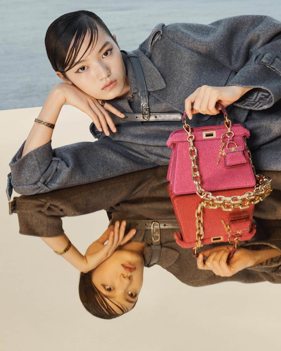 Fendiのインスタグラム：「Fendi in every detail. A new Pico Peekaboo with Fendi Roma detailing and the Chain Strap You have been created to personalise the #FendiPeekaboo.  Discover the Peekaboo and a selection of accessories in boutiques and on Fendi.com.  Artistic Director of Couture and Womenswear: @mrkimjones  Artistic Director of Accessories and Menswear: @silviaventurinifendi  Artistic Director of Jewellery: @delfinadelettrez   Styling: @elliegracecumming Hair: Shingo Shibata Makeup: Kiki Gilford  Casting: @shelleydurkancasting Model: Huijia Chen  Photography: @hannamoon69  Set: @mattjacksonmattjackson」
