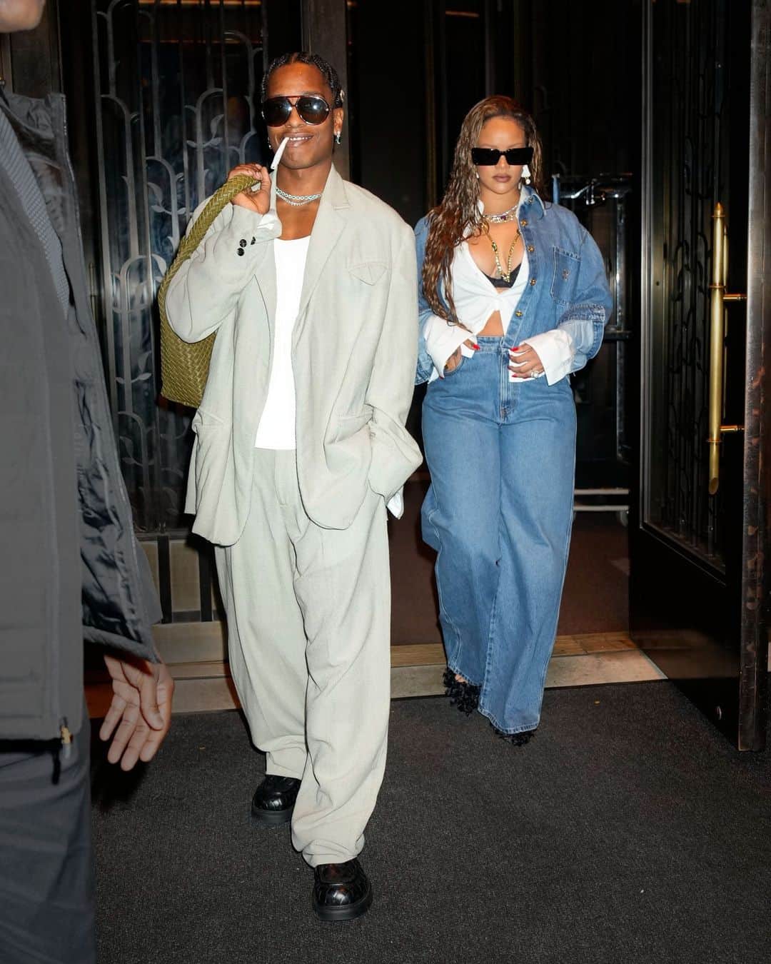 Harper's BAZAARのインスタグラム：「@badgalriri and @asaprocky continued the rapper's fashion-filled birthday week last night, as they showed their It-couple street style during another outing in NYC. Each of them elevated their breezy looks with layers of jewels, and Rih showed her sultry side with a peek of her lacy black bra. More of their night out at the link in bio.」