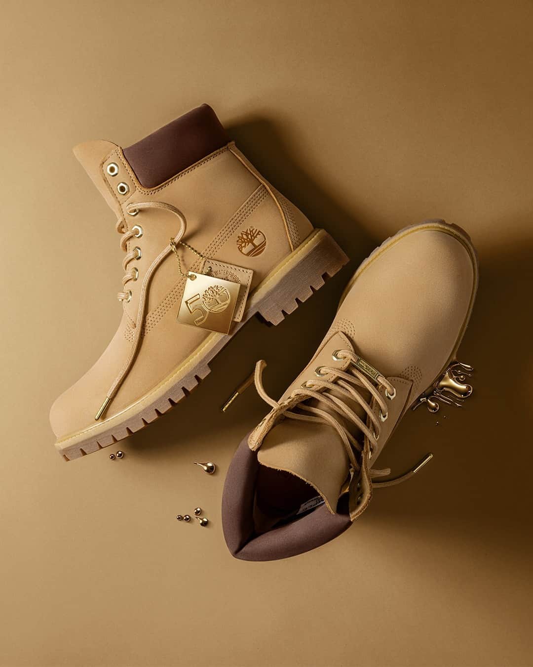 ティンバーランドのインスタグラム：「Stay Golden. 🏆  The Timberland® 50th Edition Butters Collection features a five iconic silhouettes from the vault, including the Original Timberland® Boot, Euro Hiker, 3-Eye Lug Boat Shoe in men’s and women’s sizes. The Super Boot exclusively in men’s sizes, and the 14-inch WP Boot exclusively in women’s sizes.  Lightweight insulation, premium waterproof leather and a bold buttery colorway that is sure to turn heads.  #BUTTERS #TIMBERLAND50 #BUILTFORTHEBOLD」