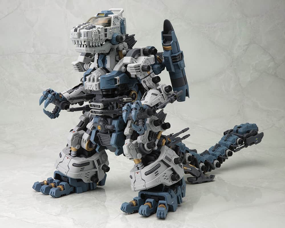 株式会社 壽屋 コトブキヤのインスタグラム：「Zoids fans are invited once more!  The dinosaur-type Zoid Gojulas, which was released to celebrate the 30th anniversary of Zoids and is the largest kit in HMM history, is back with bonus parts! Coming in at 322mm (H) × 513.5mm (L) × 195mm (W), this absolute monster of a kit is a blast to build. The proportions have been arranged to be more aggressive for the HMM series, thus allowing for more powerful posing! Joints in various parts of the model are also articulated to be able to create poses with fierce roars and fighting scenes. In addition to the decals from the last version, a whole new set of decals reminiscent of the first series of Zoids is included. What’s more, a set of colorless clear parts is included so that those who prefer to paint their models themselves can do so in combination with the various colored parts.  Add the most powerful weapon in the Helic Republic's arsenal to your collection today!  Features:  ・The polyethylene caps in each joint that support the humongous body of the Zoid are larger to ensure stability when displayed. ・The cockpit hatch on the head can open and close, and hold the included pilot figure. ・The Zoid Core inside the abdomen is removable. ・The container block on the tip of the tail can be opened to extend the Maxer 30mm Beam Cannon. The Maxer 50mm Cannons on the sides of the tail tip can also be stowed inside the tail. ・The model's heels are articulated, allowing the model to lean forward. ・Includes a set of colorless clear parts as bonus parts. ・Decals of various emblems and warning signs are included and can be applied as desired for a more show-accurate finish.  © ＴＯＭＹ　　ZOIDS is a trademark of ＴＯＭＹ Company,Ltd. and used under license.  Available April 2024.」