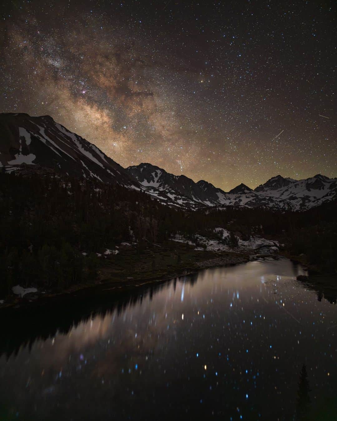 National Geographic Travelのインスタグラム：「Photos by @BabakTafreshi | Above a lake at 10,000 ft elevation in the Eastern Sierra, California, the Milky Way rises in the starry sky. The orange star Antares, marking the heart of the celestial Scorpion, is the brightest in the view. I was on Life at Night project for the National Geographic Society with my colleague Oshin Zak (photo 2). We have photographed the night sky together since teenage-hood in the early 1990s, when we grew up in Iran. @insidenatgeo   #WorldSpaceWeek」