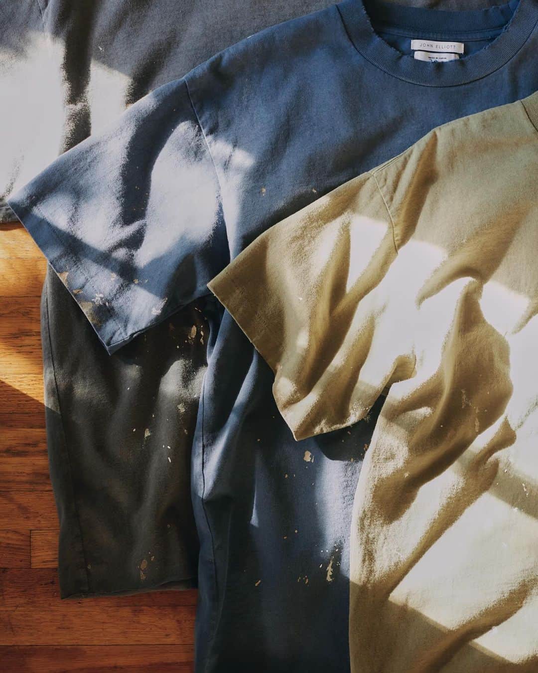 ジョン エリオットのインスタグラム：「Odeon Tee - Available Now  Introducing the Odeon Tee, an all-new boxy, cropped silhouette. Made in Japan, we utilize nuanced production techniques that are traditionally reserved for denim. Each garment has a uniquely aged aesthetic, with a worn-to-perfection look and feel.」