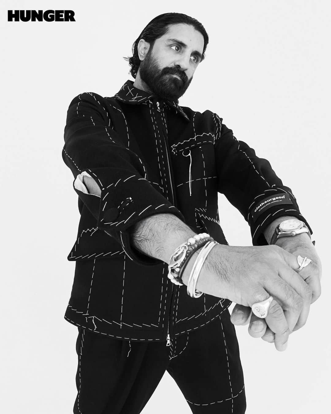 クロスサージョンのインスタグラム：「Not many fashion designers start off as professional football players. But then there’s Rav Matharu.⁠ ⁠ At the age of 17, Matharu began playing for Leeds United, but now the boots are in the bag and the bag is made by his streetwear clothing label, clothsurgeon. The creative director and founder has the first bespoke streetwear store on London’s Savile Row, making one-of- a-kind pieces for the likes of Daniel Kaluuya, Kano and Nas.⁠ ⁠ “Streetwear is quite a broad term. Sometimes it can scare people,” he tells HUNGER as part of Issue 29’s HUNGRY series. “But it is whatever you feel comfortable wearing on the street and what gives you confidence. It’s that attitude and that confidence you feel in wearing something that fits amazing.”⁠ ⁠ Founder and Creative Director @matharu_rav of @clothsurgeon⁠ ⁠ Photographer @rankinarchive⁠ Editorial Director @devinderbains⁠ Stylist @morrrgss⁠ Hair Editor @nickirwinhair using @schwarzkopfprouk and @wahlprouk⁠ Make-up Artist @zcmua using @patmcgrathreal and @armanibeauty ⁠ Photography Assistants @oliverdundas, @alexandra_heron, @marcuslister96, @cnawanga at @rankinassistants⁠ Fashion Assistants @oliviamillre @alananewton_ @drewcharsmith⁠ Make-up Assistants @jazcrush.artistry⁠ Hair Assistants @alexsarghe, @feelbreezee⁠ Production @sarah__the__star⁠ Production Assistant @renequesamuels⁠ Retouching @trueblackstudio⁠」