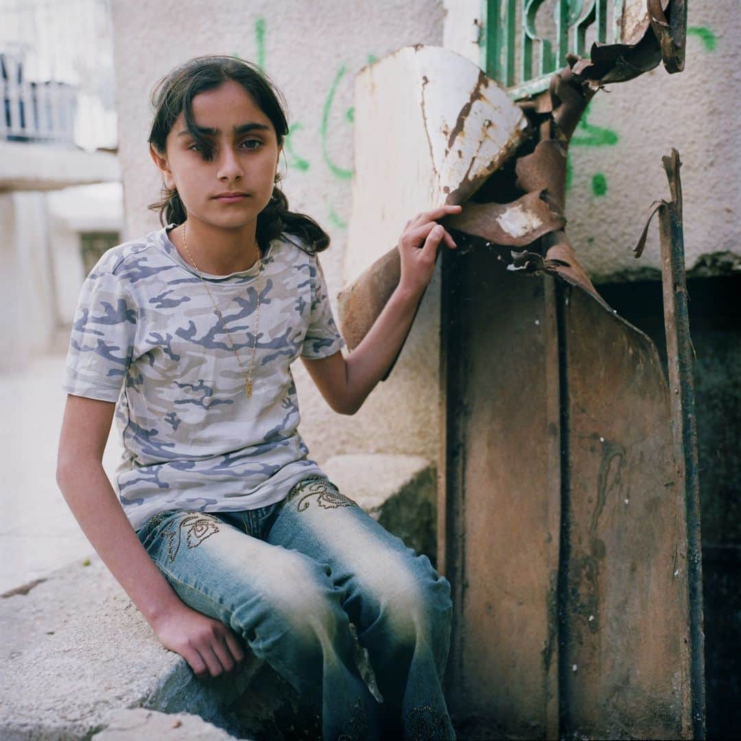 Magnum Photosさんのインスタグラム写真 - (Magnum PhotosInstagram)「@alessandra_sanguinetti: "I first traveled to Palestine in 2003 and 2004, and visited refugee camps in Gaza and Bethlehem. The resulting images document the lives and experiences of young Palestinians growing up amidst the decades long Israeli military occupation, facing daily dangers and human rights violations."⁠ ⁠ Since Hamas launched an unprecedented attack on Israel via the Gaza Strip on Saturday, October 7, killing hundreds of civilians, Israel has dropped more than 1,000 tons of bombs and 2,000 unspecified weapons, so far killing around 600 people, including 78 children, and wounding thousands, according to the Gaza Health Ministry. The U.N. humanitarian agency reports that the strikes have displaced almost 125,000 Palestinians in Gaza.⁠ ⁠ Today, Israel has cut off food, water and fuel from the two million people trapped in Gaza.⁠ ⁠ PHOTOS (left to right): ⁠ ⁠ (1) Separation wall. Abu Dis. 2004. ⁠ ⁠ (2) Zanya and Jasmine overlooking the construction of the separation wall that will isolate them from their town. Abu Dis. 2003. ⁠ ⁠ (3) Riham Khaled Abuheen was shot in the eye by IDF forces during a raid on her building. Shajaiaya. Gaza Strip. 2003. ⁠ ⁠ (4) Landscape. Gaza Strip. 2003. ⁠ ⁠ (5) Hooda next to the door her mom died behind when Israeli soldiers blew through it. Aida refugee camp. 2004.⁠ ⁠ (6) Kids playing. Aida refugee camp. West Bank. 2004. ⁠ ⁠ (7) Schoolgirls. Bethlehem. West Bank. 2003. ⁠ ⁠ (8) Hadir Rizq in a destroyed house. Gaza Strip. 2003. ⁠ ⁠ (9) Schoolgirls looking back at Israel's separation wall and sniper tower. 2003. ⁠ ⁠ © @alessandra_sanguinetti / Magnum Photos」10月10日 4時01分 - magnumphotos