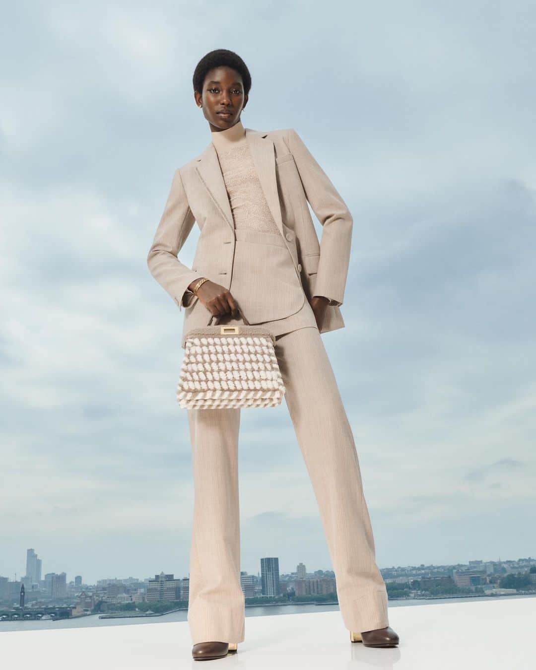 Fendiのインスタグラム：「The Maison's mastery of materials proven once more by a new interpretation of the #FendiPeekaboo Interlace.   Artistic Director of Couture and Womenswear: @mrkimjones  Artistic Director of Accessories and Menswear: @silviaventurinifendi  Artistic Director of Jewellery: @delfinadelettrez   Styling: @elliegracecumming Hair: Shingo Shibata Makeup: Kiki Gilford  Casting: @shelleydurkancasting Model: Laura Reyes  Photography: @hannamoon69   Set: @mattjacksonmattjackson」