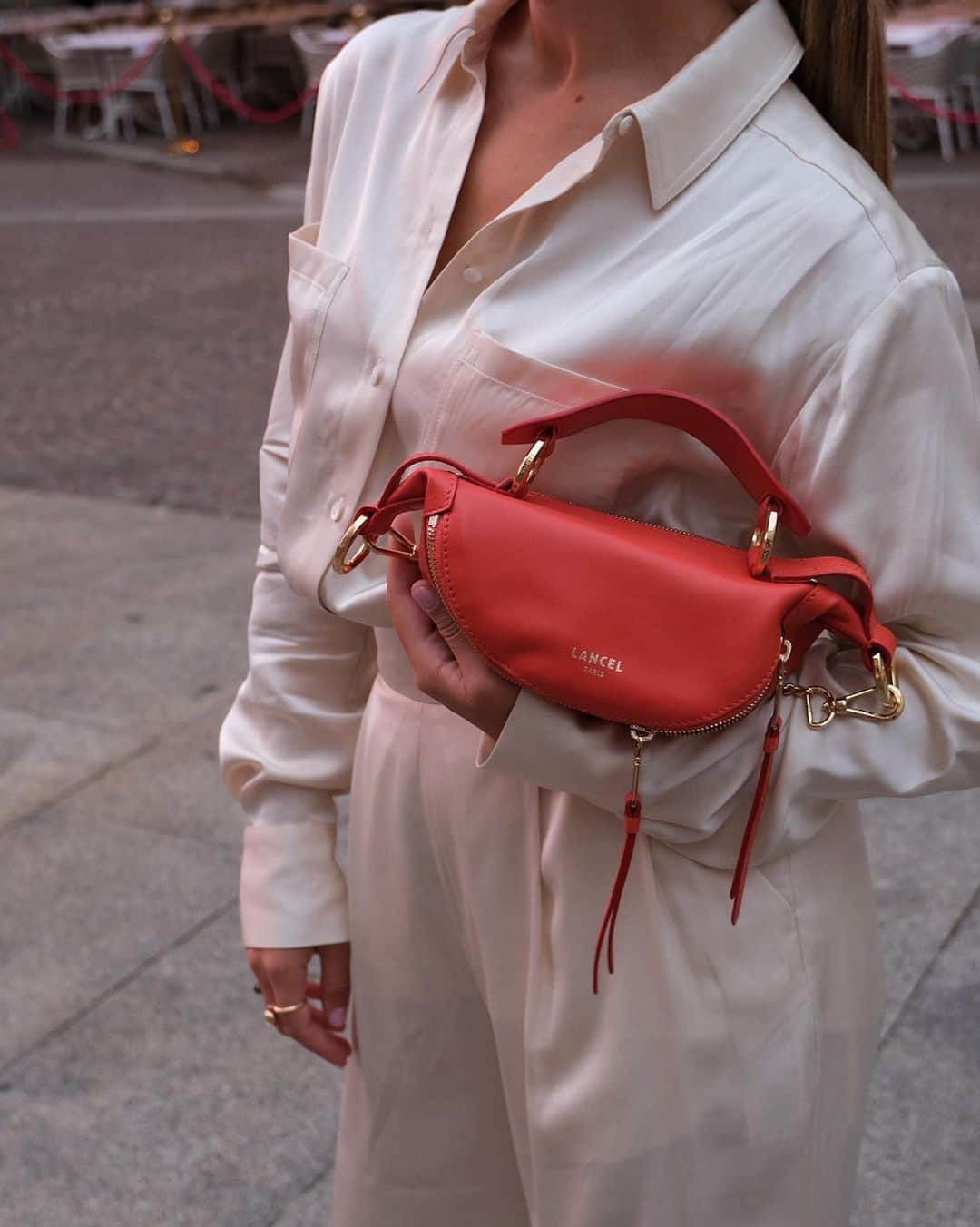 ランセルのインスタグラム：「This season, color is essential to brighten up your outfits!  @rossellinaa   Origami – Smooth leather – Pumpkin  #LancelParis #FW23 #LancelTwist #OrigamiByLancel」