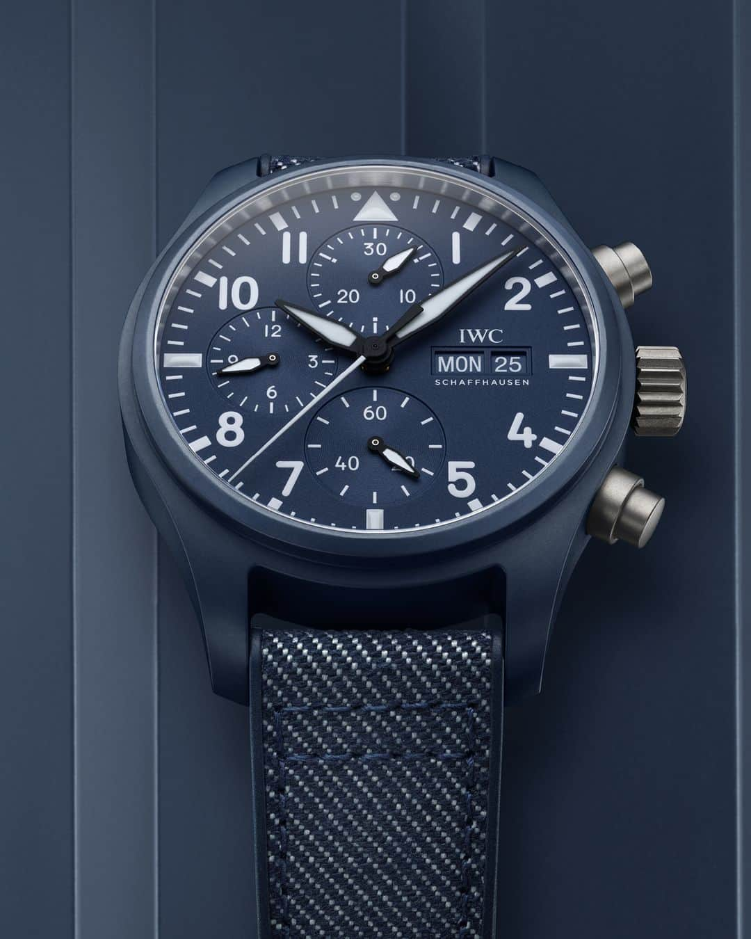 IWCのインスタグラム：「Reminiscent of the deepest ocean depths, Oceana is a boundless and fathomless marine blue hue inspired by the waters surrounding Naval Air Station Oceana, the Navy’s East Coast Master Jet Base.  The Pilot's Watch Chronograph 41 Top Gun Oceana is our latest monochrome timepiece, due to the complexity of sintering raw materials into ceramic, it takes high skilled engineering to achieve this new tastefully understated color. The pushers and the case back are made of lightweight titanium and the matching blue rubber strap has a unique denim finish textile inlay.  #IWCpilot | #TheReference | #IWCtopgun  🔗Link in Bio  #IWCoceana color created with @pantone.  Ref. IW389404」