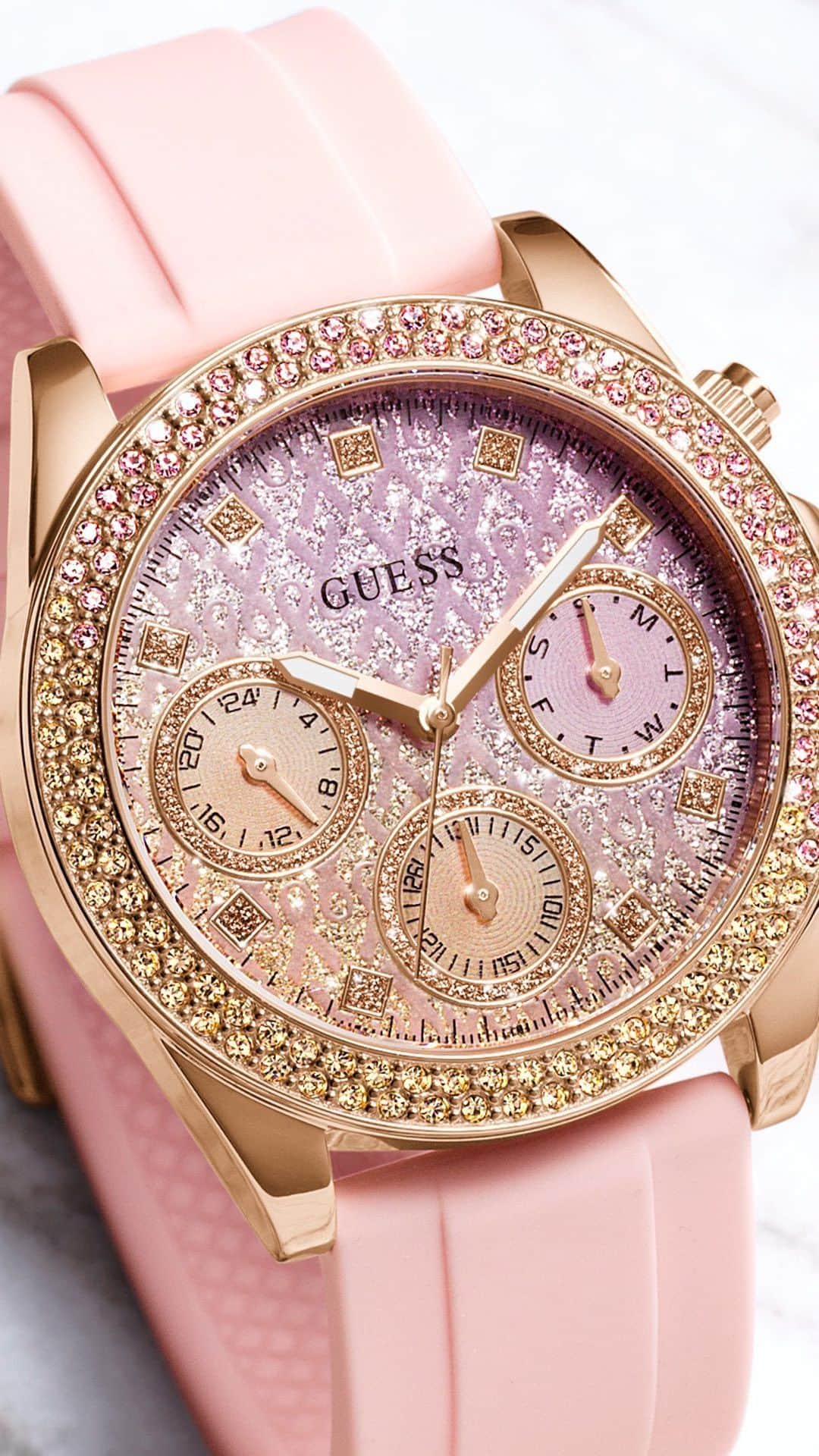 ゲスのインスタグラム：「Introducing this year’s signature Sparkling Pink timepiece offering fashion and function with colorful crystal bezel, glitter ombre dial and multi-function movement complimented with a sporty pink silicone strap. Wear yours in support of @getintouchfoundation.   #GUESSWatches #BreastCancerAwarenessMonth」