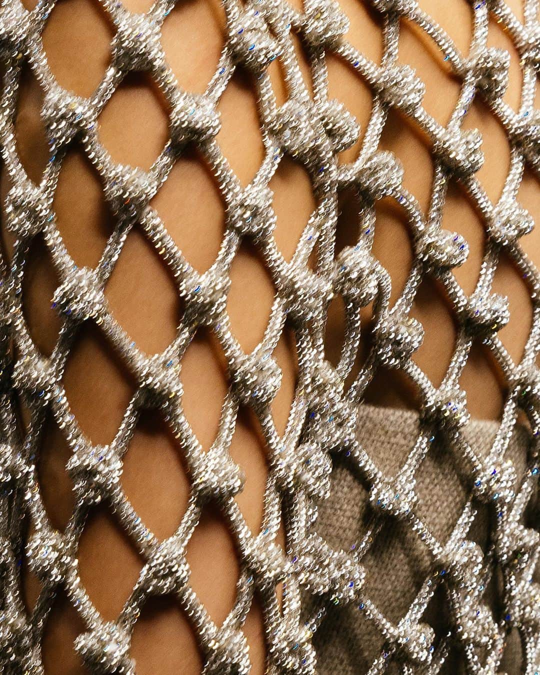 Valentinoのインスタグラム：「A sparkling twist on precious workmanship.​  For #ValentinoLÉcole, @pppiccioli plays a masterful game of materiality on a hand-knotted shimmering rhinestone dress.​  Discover every look now by visiting the link in bio.」