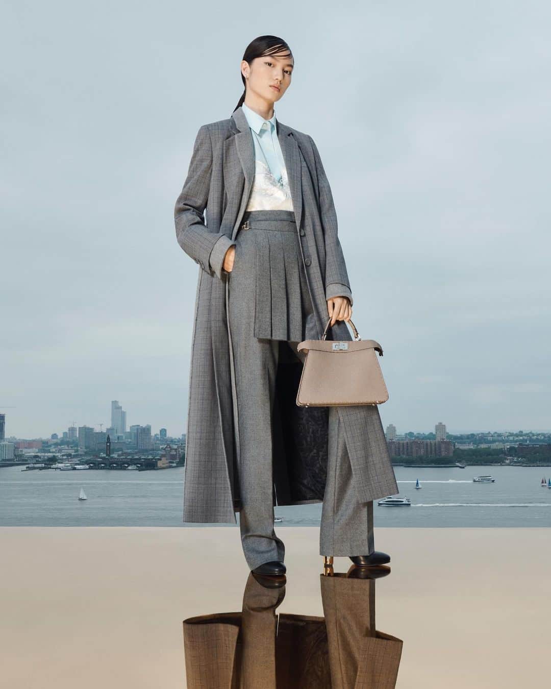 Fendiのインスタグラム：「Silvia Venturini Fendi’s modern version of a great classic bag, the iconic #FendiPeekaboo is emblematic of Fendi DNA: craftsmanship, experimentation, and creativity.   Discover the selection in boutiques and at Fendi.com.  Artistic Director of Couture and Womenswear: @mrkimjones  Artistic Director of Accessories and Menswear: @silviaventurinifendi  Artistic Director of Jewellery: @delfinadelettrez   Styling: @elliegracecumming Hair: Shingo Shibata Makeup: Kiki Gilford  Casting: @shelleydurkancasting Model: Sijia Kang  Photography: @hannamoon69   Set: @mattjacksonmattjackson」