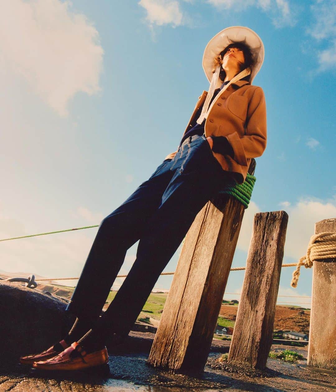 ル・モンサンミッシェルのインスタグラム：「Iris wears our Victorienne Wool Jacket.   A mid-season version of our work jacket.  Just perfect for a day by winded sea or a stroll in your city.   —  Iris porte la Veste Victorienne en laine. La version mi-saison de notre veste de travail.」