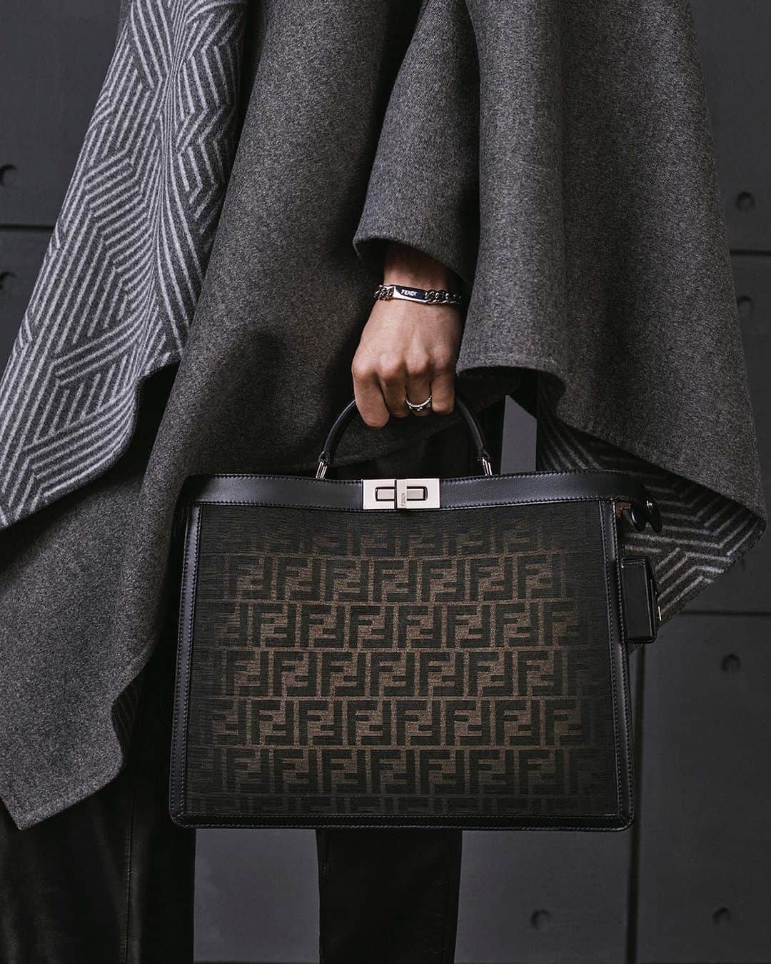 Fendiのインスタグラム：「The #FendiPeekaboo in FF Eclissi jacquard, a new interpretation of the icon, embellished with the heritage motif and hand-shaded edges.  Artistic Director of Accessories and Menswear: @silviaventurinifendi  Artistic Director of Jewellery: @delfinadelettrez   Styling: @ganio Hair: @ramoneyluv Makeup: @samiamohsein  Casting: @piergiorgio Model: Yoesry Detre  Photography: @brunostaub」