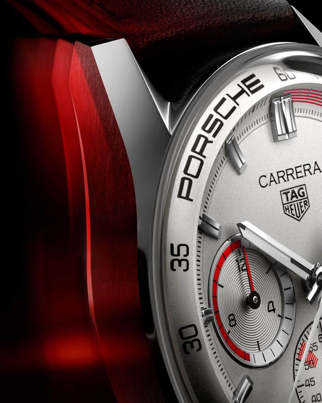 タグ・ホイヤーのインスタグラム：「A Curved Tribute to Timeless 1970s Elegance⁣ ⁣ The TAG Heuer Carrera Chronosprint x @Porsche elevates innovation with its double glassbox design. Named "glassbox" for its curved, domed crystal glass, it pays homage to the iconic hesalite crystal designs of the 1970s. This reengineered curve flows seamlessly along the dial's edge, seamlessly merging with the case for a truly distinctive look.⁣ ⁣ #TAGHeuer #TAGHeuerCarrera⁣」