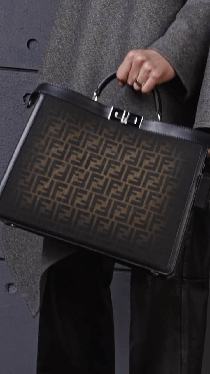 Fendiのインスタグラム：「Infinitely versatile. A new iteration of the #FendiPeekaboo features the FF motif, symbol of the Maison since 1965, and maxi zippers to reveal its dual compartments.  Artistic Director of Accessories and Menswear: @silviaventurinifendi Artistic Director of Jewellery: @delfinadelettrez   Styling: @ganio Hair: @ramoneyluv Makeup: @samiamohsein  Casting: @piergiorgio Models: Yoesry Detre, Douta Sidibe  Video: @walestudioroma」