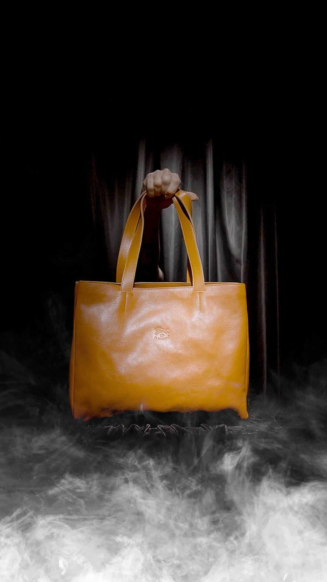 イルビゾンテのインスタグラム：「Embrace the spirit of Halloween with our spellbinding leather tote bags. Elevate your style with eerie elegance and carry a touch of enchantment wherever you go.   #ilbisonte #sustainability #madeinitaly」