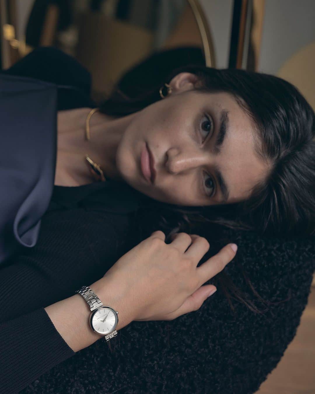 トラサルディのインスタグラム：「A key signature in the #TrussardiJewelry collection, the T-logo also defines the new #TrussardiWatches styles for #TrussardiFW23. In women's timepieces, the T-logo is enriched with pavé crystals, as elegant accents flanking the watch face.   Photographed by @ferry_mohr  Shot on location at @onhousemilano, featuring #TrussardiCasa」