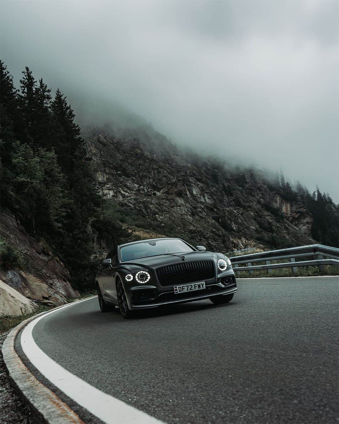 ベントレーのインスタグラム：「The road less travelled is the road worth driving.  📷 @GeorgeColbeanu  _ #Bentley #FlyingSpur Speed (W12) WLTP drive cycle: fuel consumption, mpg (l/100km) – Combined 18.8 (15.0). Combined CO₂ Emissions – 340 g/km.」