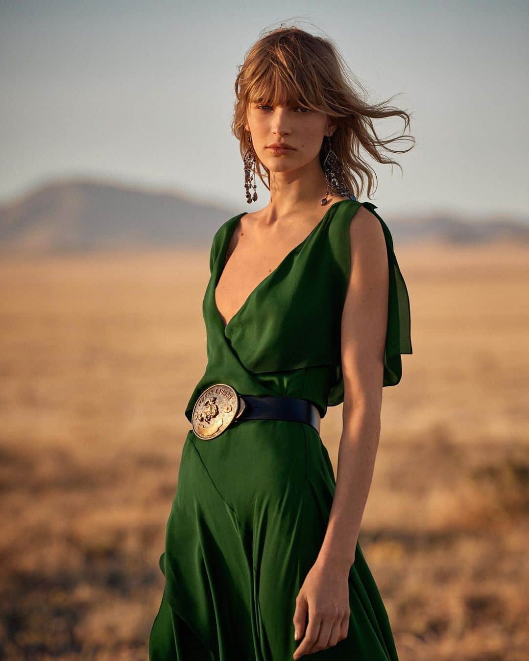 のインスタグラム：「The #RLCollection Johnathon gown.  Tiers of emerald silk georgette create effortless contrast with #RalphLauren’s equestrian-inspired buckle belt.  Discover more eveningwear from Fall 2023 via the link in bio.」