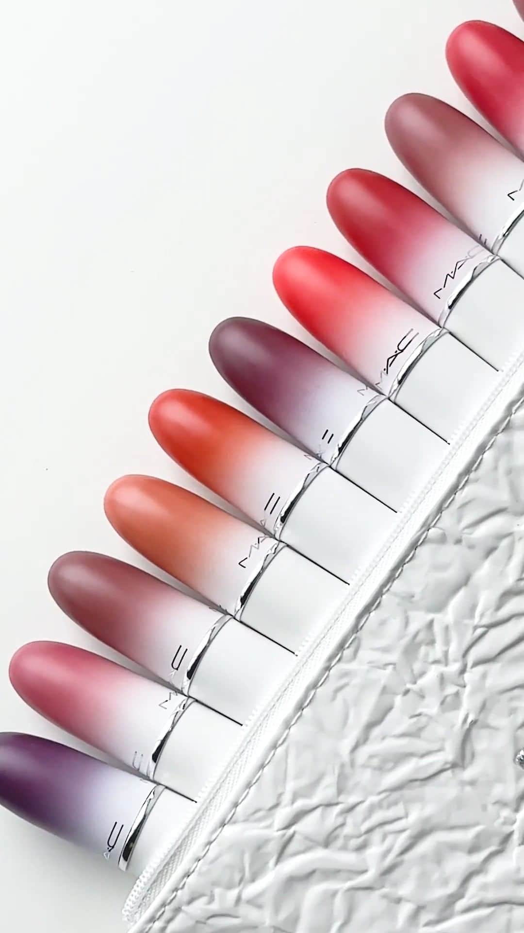 M·A·C Cosmetics UK & Irelandのインスタグラム：「Tag someone and give them a hint on what to get you this Christmas 😉 The NEW limited-edition Lips By The Dozen Mini Powder Kiss Lipstick Kit contains 12 moisture-matte lipsticks in a chic makeup bag, all for £95! (Worth £180)   Available in-store or tap to shop NOW! #MACCosmeticsUK #MACBizarreBlizzardBash #MACHoliday」