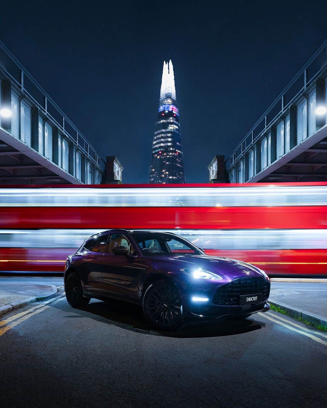 アストンマーチンのインスタグラム：「Illuminating the London skyline. Storm Purple DBX707.  #AstonMartin #DBX707 #POWERDRIVEN  Photography by @bymcnab」