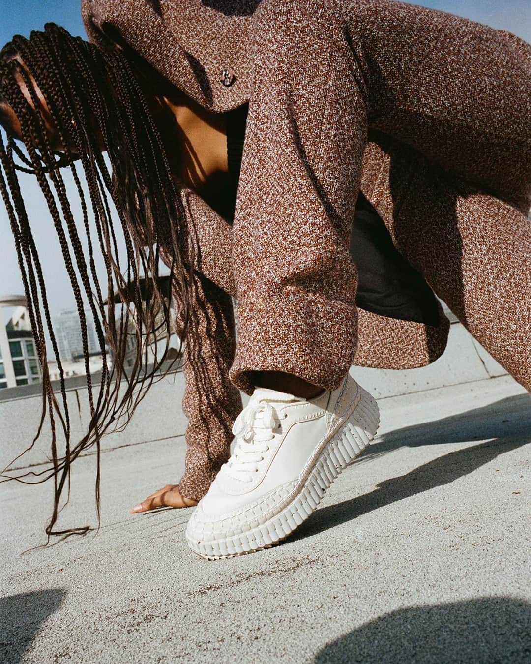 Chloéのインスタグラム：「Introducing the new white leather Nama sneaker, which debuts in a film directed by @claracullen and a series of photographs by @maxfarago shot on location in Los Angeles – both featuring dancer @thelastbirdinthesky.   With its hand-stitched welt, recycled sole and lower impact materials, the new leather Nama develops the signatures of the classic design.  The leather Nama sneaker is available on Chloe.com.」