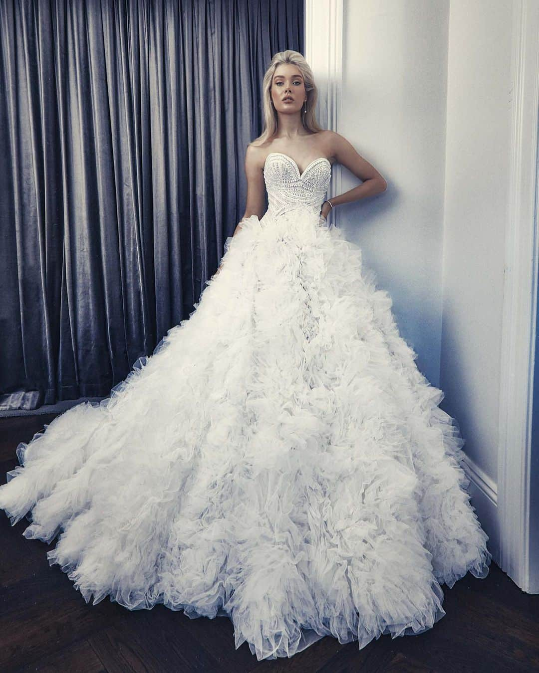 Steven Khalilのインスタグラム：「The Rafaela gown | An exquisite masterpiece of bridal fashion. Crafted entirely from tulle layering , this gown embodies a sense of timeless purity and sophistication. The focal point of the Rafaela gown is its circular ruffle skirt, a design element that brings a whimsical and romantic touch to the gown #stevenkhalil #stevenkhalilbride #weddinggown #bridal」