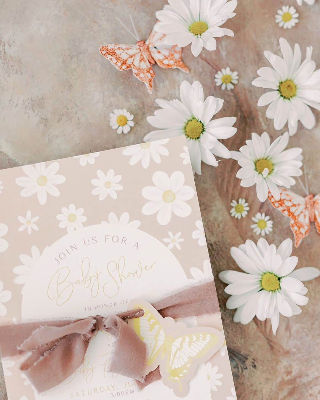 Ceci Johnsonさんのインスタグラム写真 - (Ceci JohnsonInstagram)「BABY SHOWER | Presenting our couture invitation for Kaytlin’s baby shower. The design incorporates lovely daisy watercolors printed on 4-ply luxe paper, inviting guests to partake in the blooming journey of love and anticipation. Adorned with a soft blush ribbon, it carries a delicate paper butterfly, symbolizing the grace and transformation that a new life brings.  #CeciCouture ⠀⠀⠀⠀⠀⠀⠀⠀⠀ CREATIVE PARTNERS Invitation: @cecinewyork Photographer: @kelseylanaephotography  Florals: @poppylanedesign  Cookies: @meant2bbakery  ⠀⠀⠀⠀⠀⠀⠀⠀⠀ #cecinewyork  #coutureinvitation  #babyshowerinvitation  #daisyinvitation #beautifulstationery」10月17日 22時26分 - cecinewyork