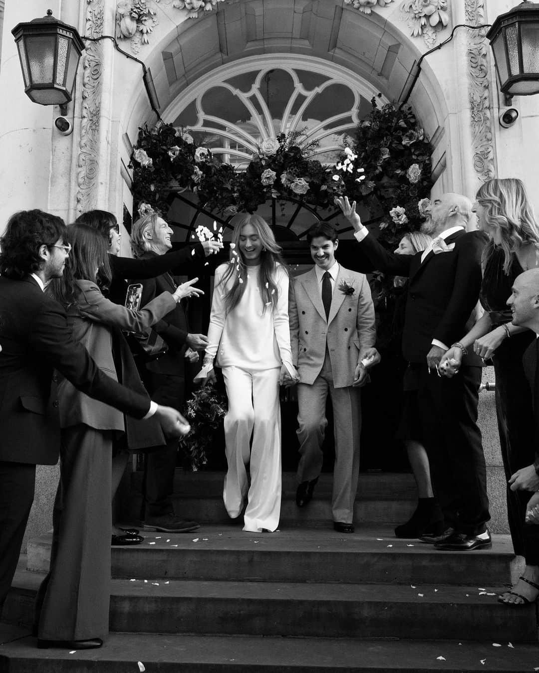 のインスタグラム：「Designer @Harris_Reed didn’t realise he was about to be proposed to when he arrived at The Newt in Somerset last November: “I kept saying ‘Oh my goodness, someone’s getting engaged in our spot.’” @EitanSenerman got down on one knee with a 1920s toi et moi ring, and the couple quickly decided on tying the knot at Chelsea Old Town Hall, ahead of a bigger ceremony in Italy next summer. “Everything was catered to this idea of like, ‘This is going to be the little fantasy that I was told as a young queer kid I could never have,’” Harris told #BritishVogue. At the link in bio, take a closer look at their intimate wedding.  Photographed by @JasonLloydEvans」