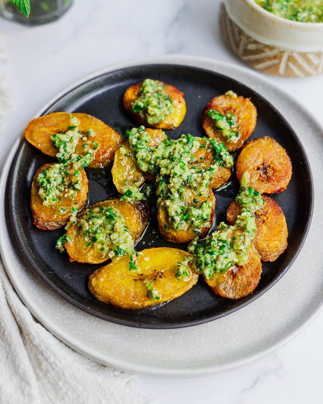 Food Republicさんのインスタグラム写真 - (Food RepublicInstagram)「Sweet Golden Maduros With Mint Mojo Recipe   This dish combines ripe plantains with a zesty mint mojo sauce, a Cuban-inspired condiment that adds a refreshing and tangy twist to your meal.  Recipe developed in collaboration with @immigrantstable   Prep Time: 10 minutes  Cook Time: 20 minutes  Servings: 4 servings  Ingredients: - 2 ripe plantains - Oil, for frying - ½ cup fresh mint leaves - 1 ½ tablespoons lemon juice - 2 tablespoons orange juice - 2 medium garlic cloves - 1 cup parsley - ¼ cup capers - 1 small onion - ½ cup olive oil  Directions: 1. Slice the plantains into ½-inch slices.  2. Set a pan to medium heat. Add enough oil to cover the plantains at least halfway up the sides. Place the plantain slices in the pan, forming a single layer (work in batches if necessary). Fry for 3-5 minutes, until the plantains are golden brown on one side.  3. While the plantains fry, add the remaining ingredients to a food processor or high-speed blender. Blender until a smooth texture is achieved.  4. Flip the plantains and fry on the other side, for 2-3 minutes. Remove the fried plantains and place them on a paper towel-lined plate to absorb excess oil. Repeat with remaining plantains.  5. Serve fried plantains with sauce.  -  #recipes #recipeoftheday #cooking #easyrecipe #delicious #food #yum #easyrecipes #yummy #healthyrecipe #instafood #healthyrecipes #foodie #tasty #homemade #dinnerisserved #easydinner #easydinneridea #easydinnerideas #eatup #dinnertime #dinnerdate #dinnertonight #dinnerinspo #dinnerset #dinneridea #dinnerprep #dinnertable #dinnerwithfriends」10月18日 2時05分 - foodrepublic