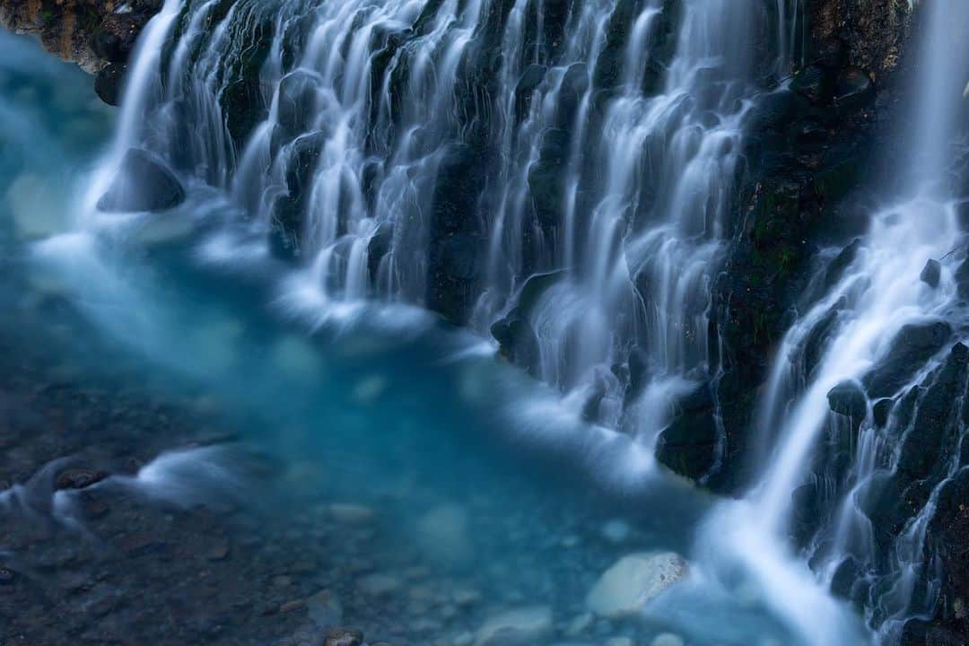 Michael Yamashitaのインスタグラム：「Shirahige no Taki (White Beard Waterfall): the aptly named source of the water in Biei’s Blue Pond. #shirohigenotaki #shirohige #shirogane #whitebeardwaterfall #bieihokkaido」